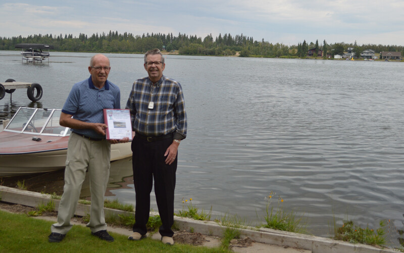 Presenting a binder to longtime resident, Ken L.